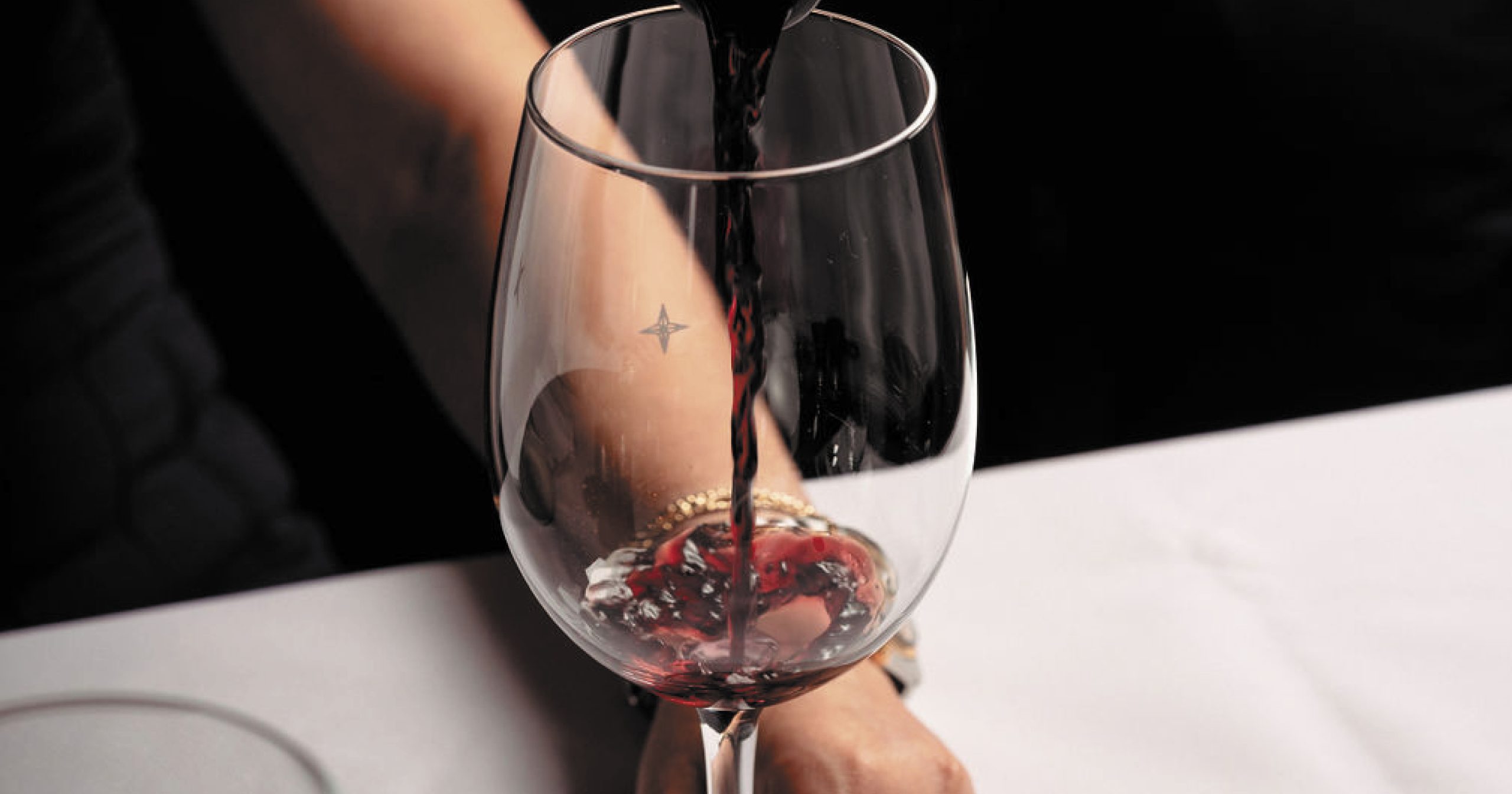 Red wine being poured into a glass