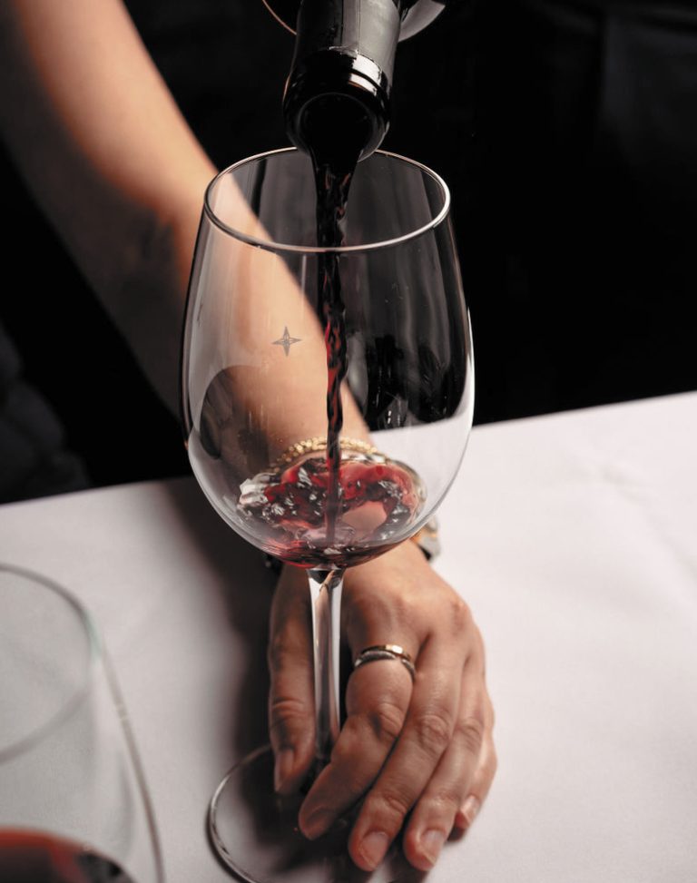 Red wine being poured into a glass